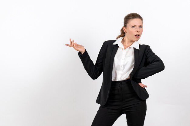 Front view young female in strict classic suit posing on a white background woman job business work costume female