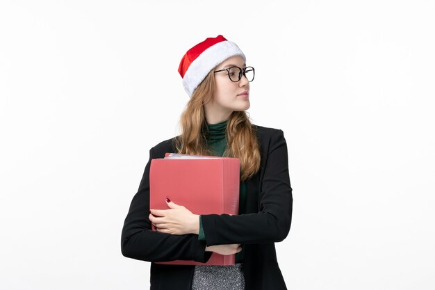 Front view young female student with files on white desk book school college