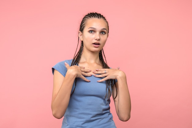 Free photo front view of young female surprised on pink