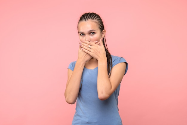 Free photo front view of young female surprised on pink