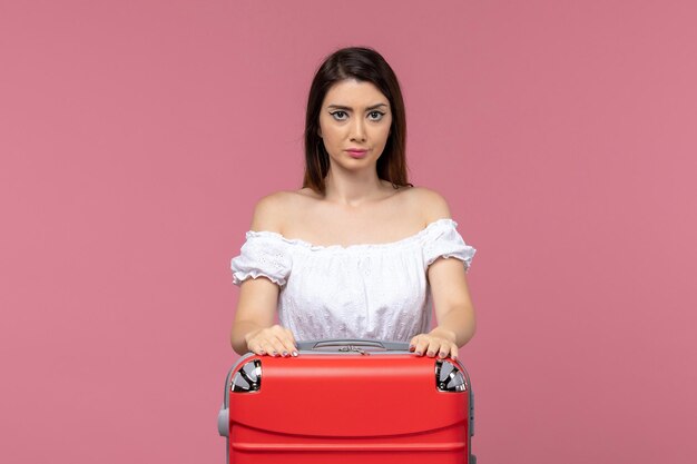 Front view young female in vacation with her bag on light pink background abroad sea journey travel trip voyage