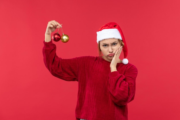 Front view young female with christmas toys, holidays christmas emotions