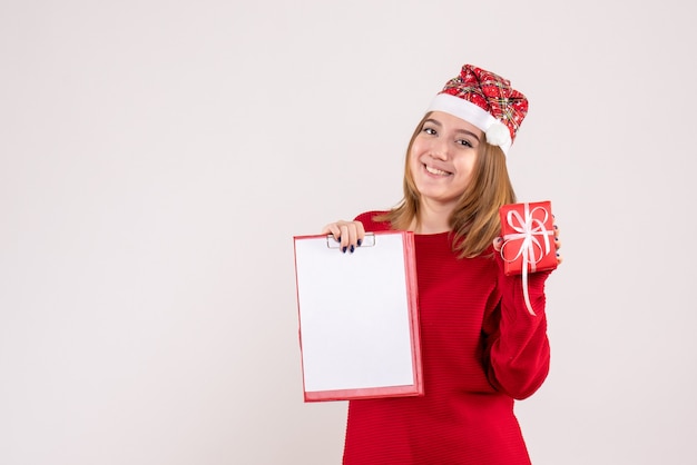 Front view young female with little present and file note