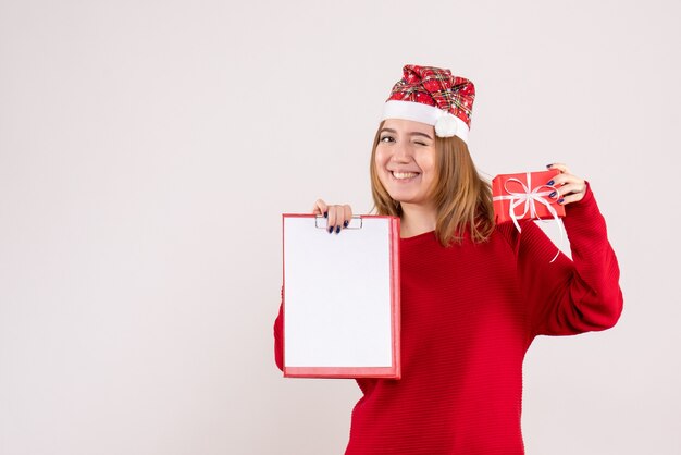 Front view young female with little present and file note