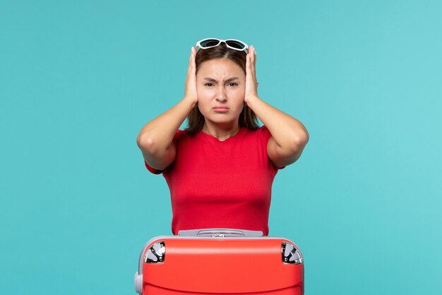 Front view young female with red bag on the blue space