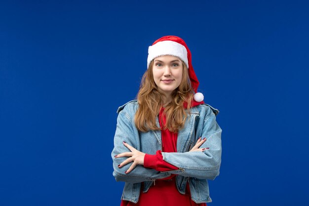 Front view young female with red christmas cap, christmas emotion holiday