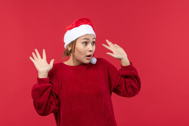 Front view young female with scared expression, holiday red christmas