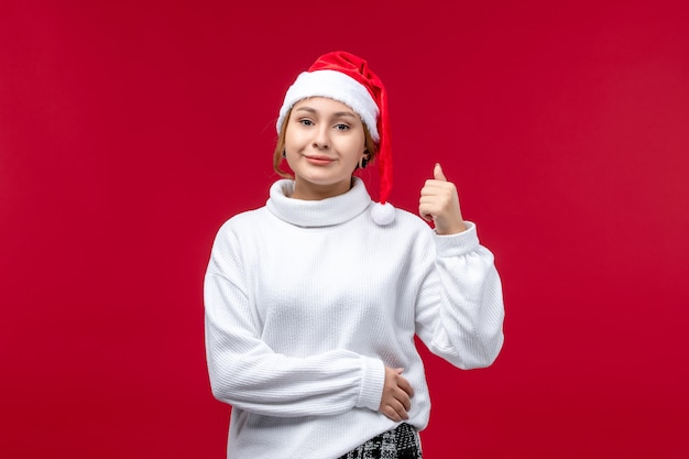 Front view young female with smiling expression on red background