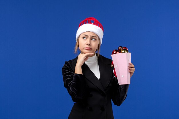 Front view young female with thinking expression on blue wall emotions new year holidays