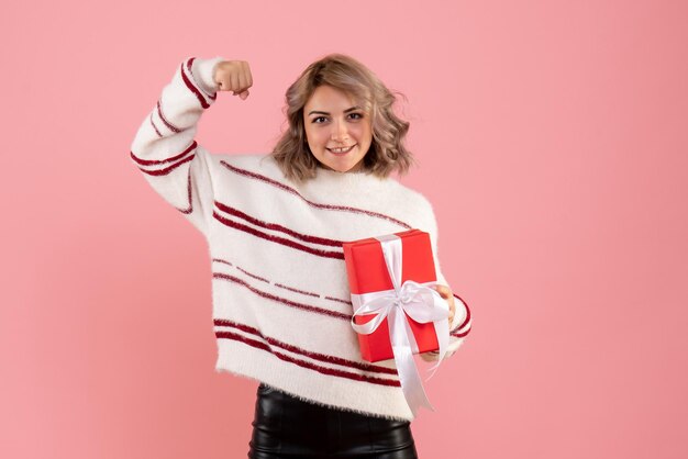 Front view young female with xmas present