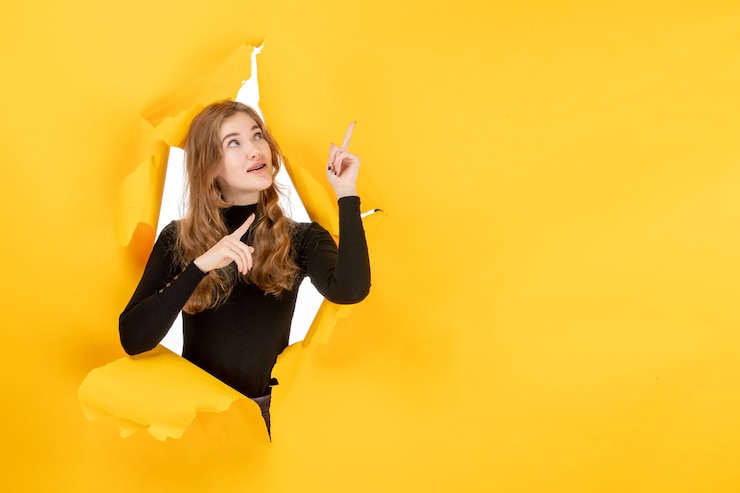 Free Photo front view young female on yellow ripped wall