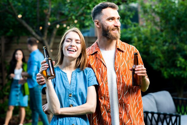 Free photo front view young friends holding drinks