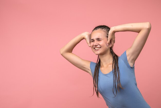 Front view of young girl excited on pink