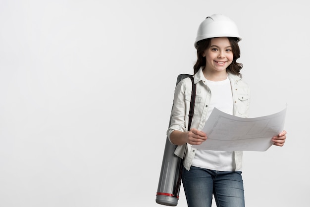 Front view young girl holding sketch with copy space