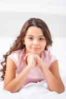 Free photo front view young girl at home staying in bed