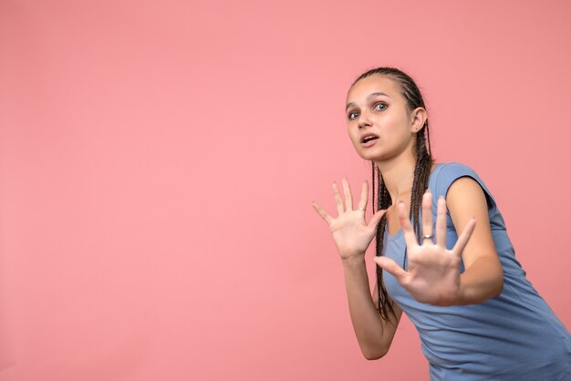 Front view of young girl on pink