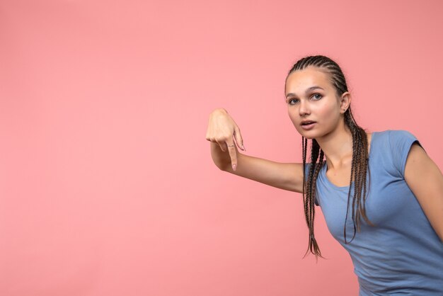 Front view of young girl on pink