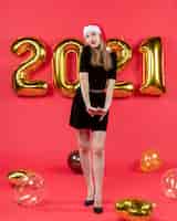 Free photo front view young lady in black dress balloons on red new year photo