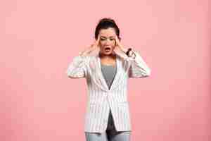 Free photo front view young lady in white jacket with surprised face on pink background fashion woman emotion color feeling lady