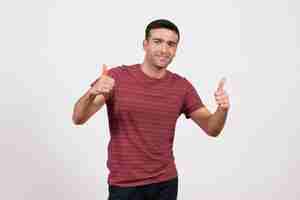 Free photo front view young male in dark-red t-shirt standing and smiling on white background