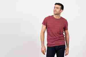 Free photo front view young male in dark-red t-shirt standing on the white background