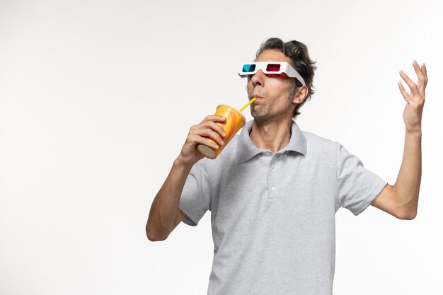 Front view young male drinking soda and wearing d sunglasses on white surface