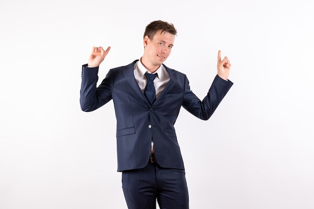 Front view young male in elegant classic suit on the white background