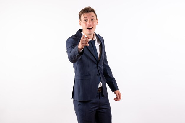 Front view young male in elegant classic suit on white background