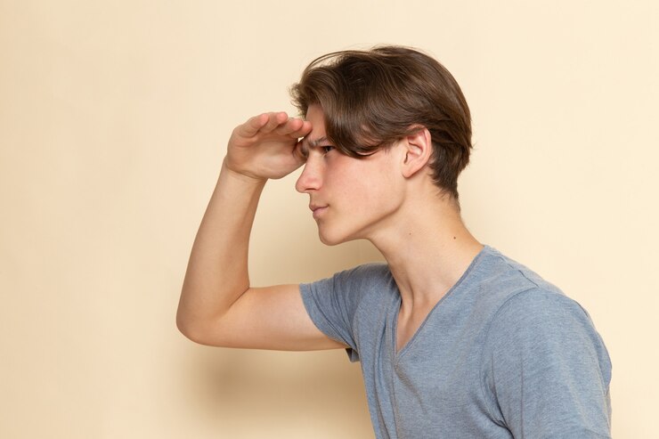 Free Photo a front view young male in grey t-shirt looking into the distance