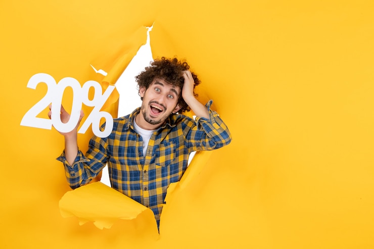 Free Photo front view young male holding writing on yellow background