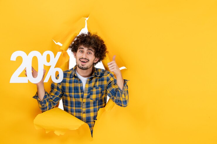 Free Photo front view young male holding writing on yellow background