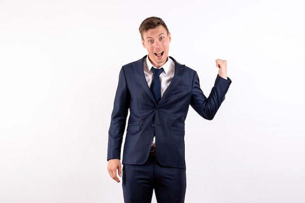 Front view young male posing in classic strict suit on light white background