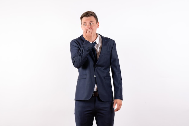 Front view young male posing in classic strict suit on a white background