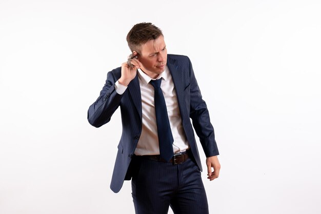 Front view young male posing in classic suit on white background