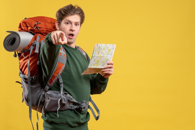 Free photo front view young male preparing for hiking holding map