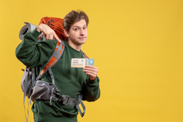 Front view young male preparing for hiking holding ticket