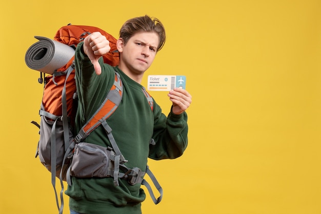 Free photo front view young male preparing for hiking holding ticket