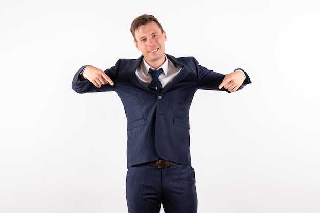 Front view young male smiling in classic strict suit on white background