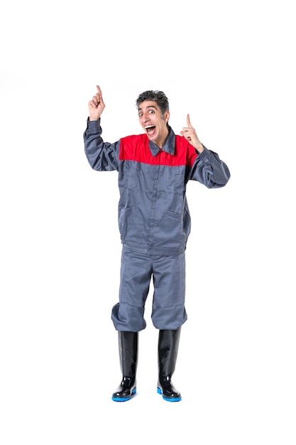 Front view young male in special uniform on a white background builder model job construction architecture worker building