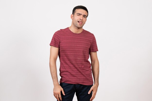 Front view young male in t-shirt posing on a white background