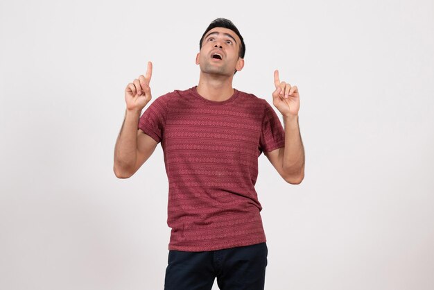 Front view young male in t-shirt posing on a white background