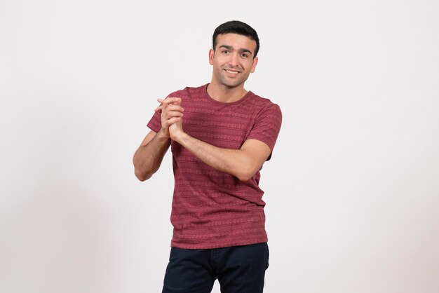 Front view young male in t-shirt posing on the white background