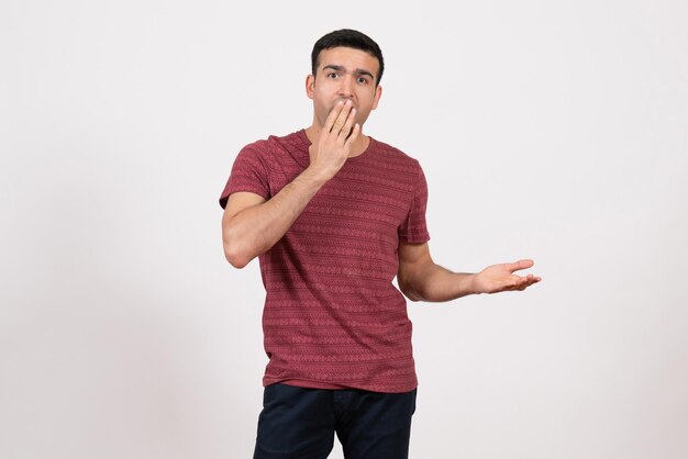 Front view young male in t-shirt posing on white background