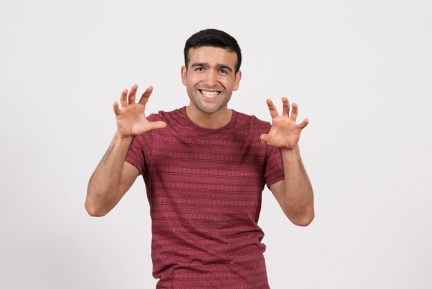 Front view young male in t-shirt standing and posing on a white background