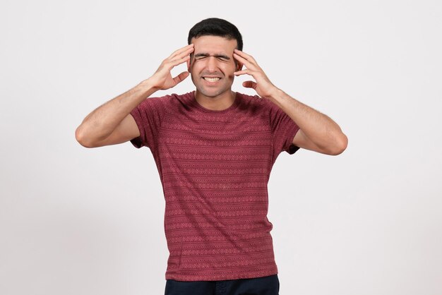 Front view young male in t-shirt standing and posing on the white background