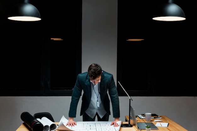 Free photo front view young male tired of working at night