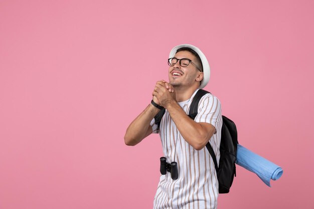 Front view young male tourist in white t-shirt on a pink background