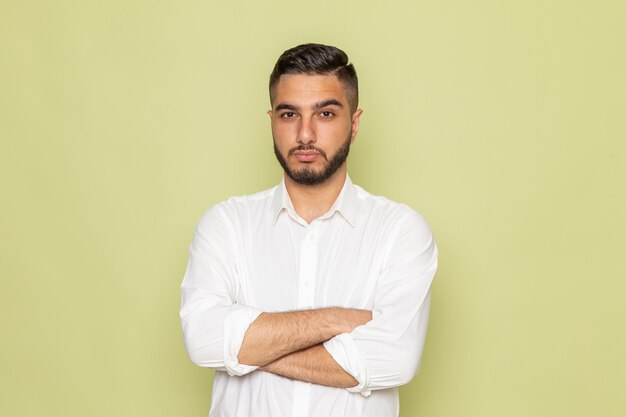 A front view young male in white shirt posing