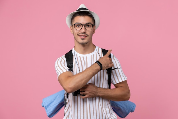 Front view young male in white t-shirt with bag on pink background