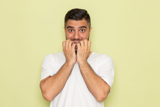 Free photo a front view young male in white t-shirt with nervous expression